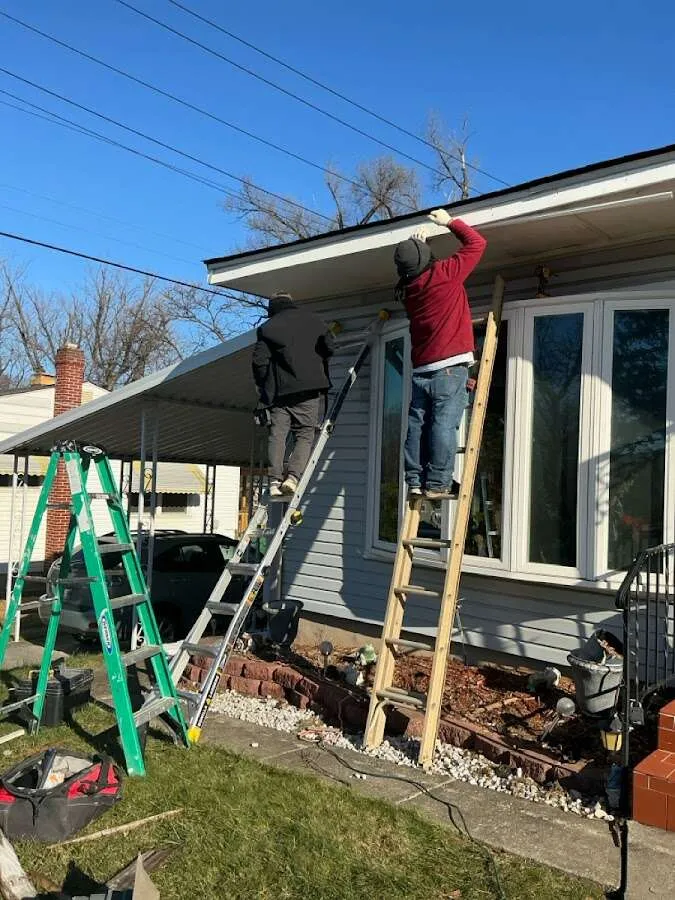 Restoration crew performing exterior repair in Vestal